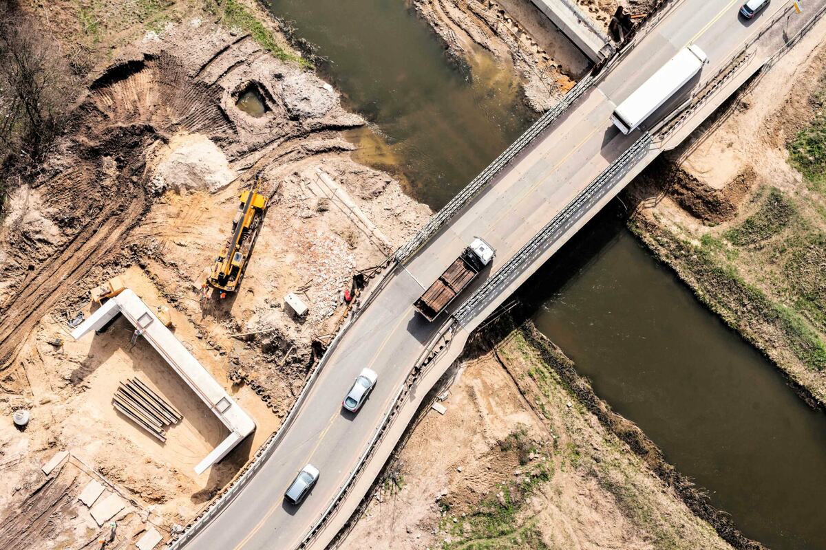 Aerial view of construction earthworks and a bridge