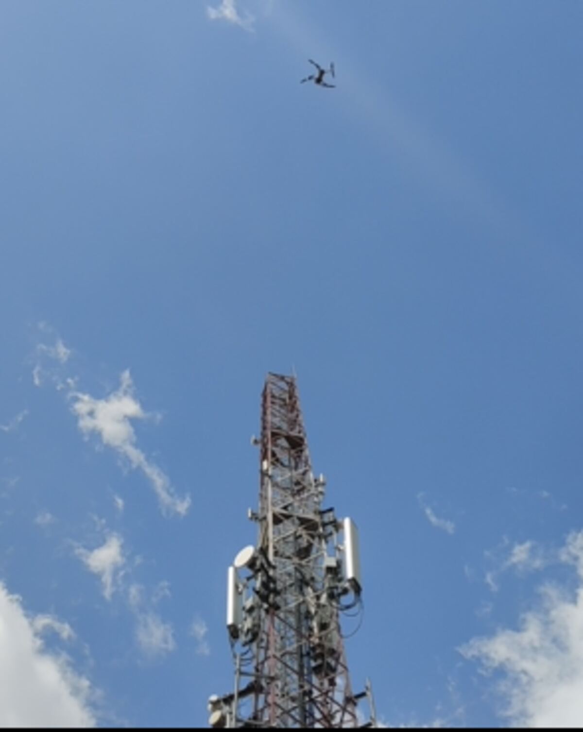 Drone inspecting a telecom tower