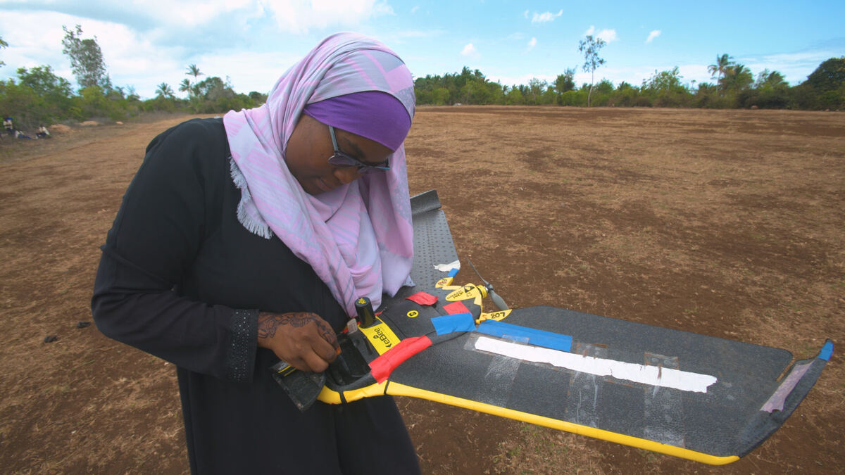 Pilot launching a fixed-wing mapping drone in Zanzibar